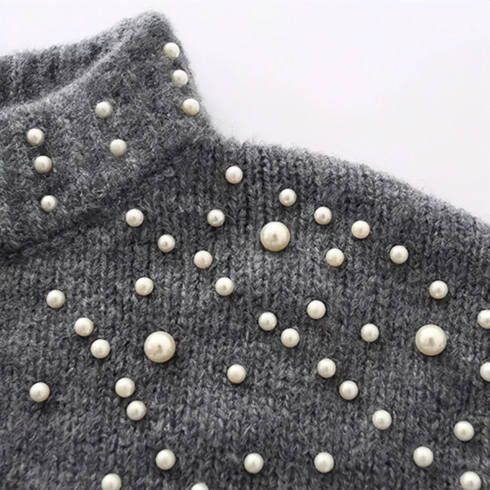 close up of pearl sweater in grey